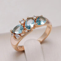 Gold ring with blue zirconia stones