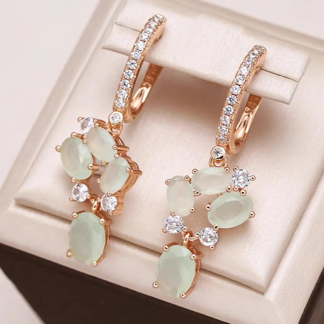 Shiny earrings with crystal stones in gold