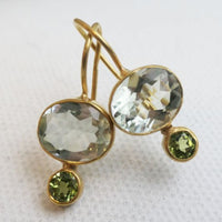 Gold earrings with green crystals