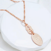 Gold-plated necklace with a shiny tip