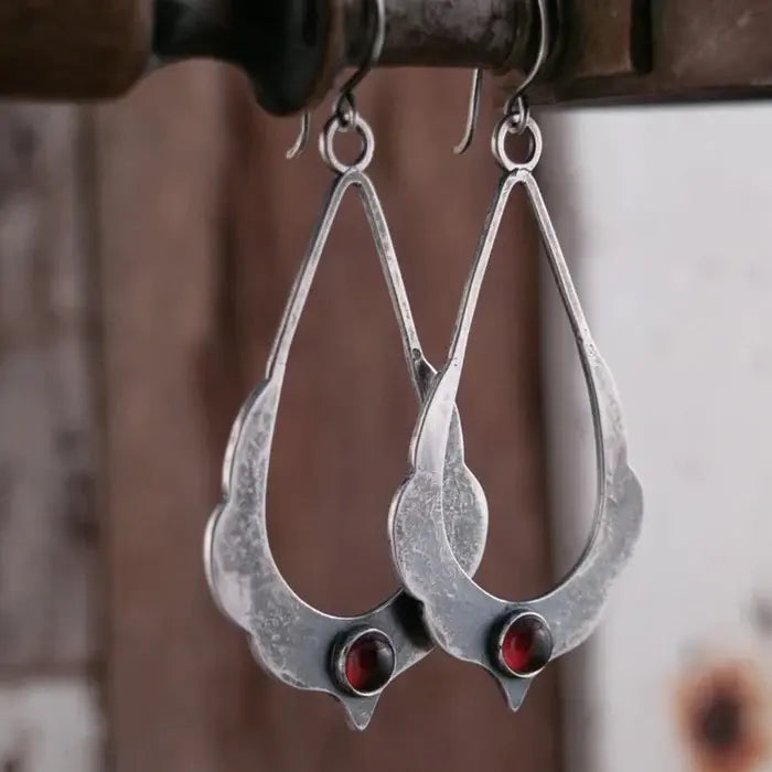 Vintage dangling earrings with red crystals